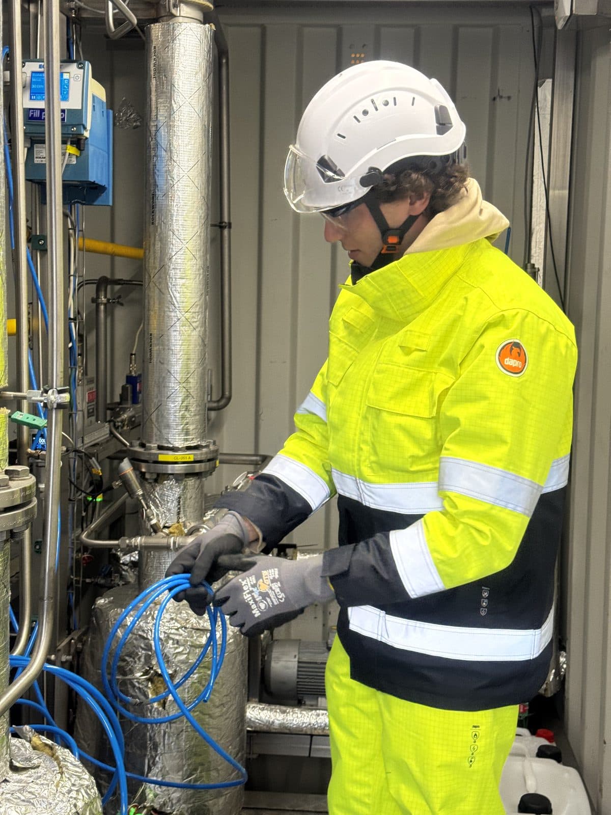 Hovyu engineer working on instrumentation inside a containerized Hyperion pilot